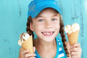 young girl with two ice cream cones in Pigeon Forge TN