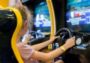 girl playing an arcade game