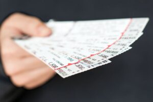 person holding tickets to a show